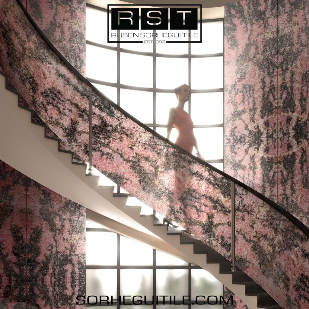A spiral staircase clad with pink and black glass tile.