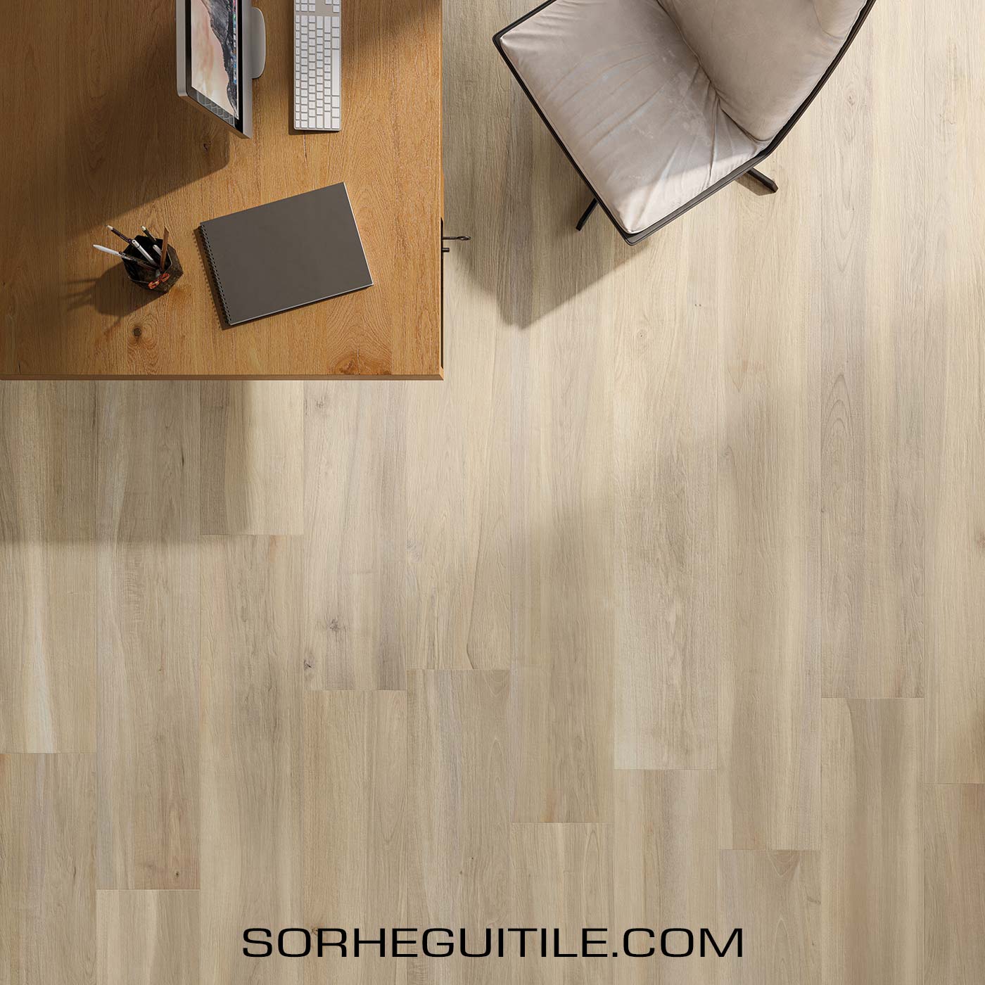 A home office with light wood look flooring.